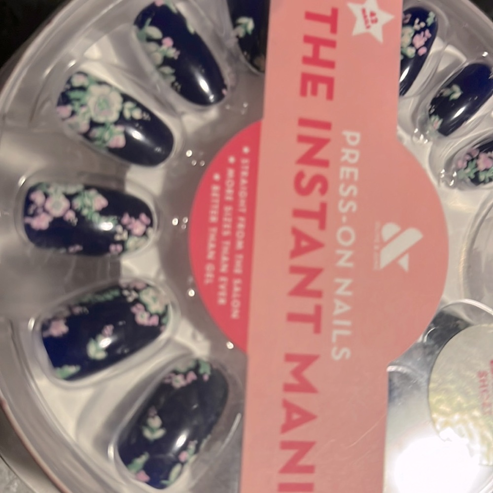 Brand new in package press on nails by the instant Manny, dark blue with floral